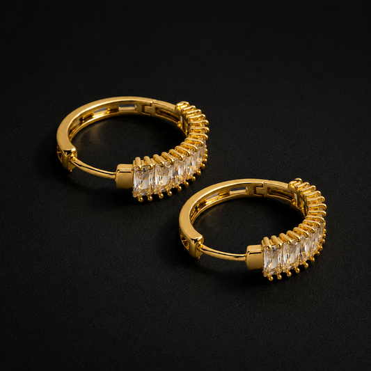 Golden Baguette Crystal Huggie Hoops on black background