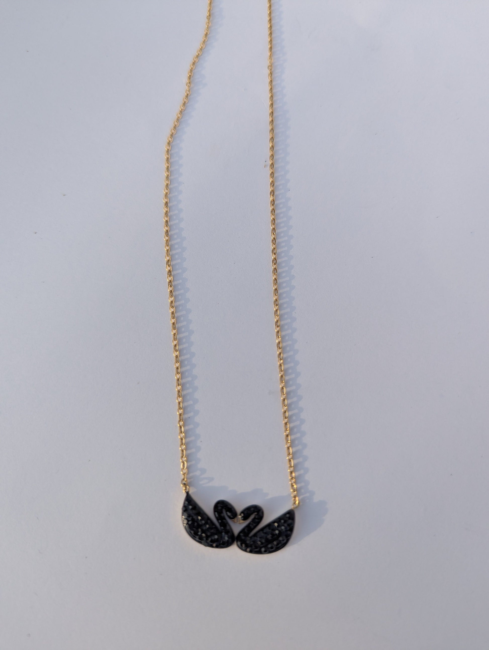 Black Swan Duo Pendant Necklace in black and gold tone